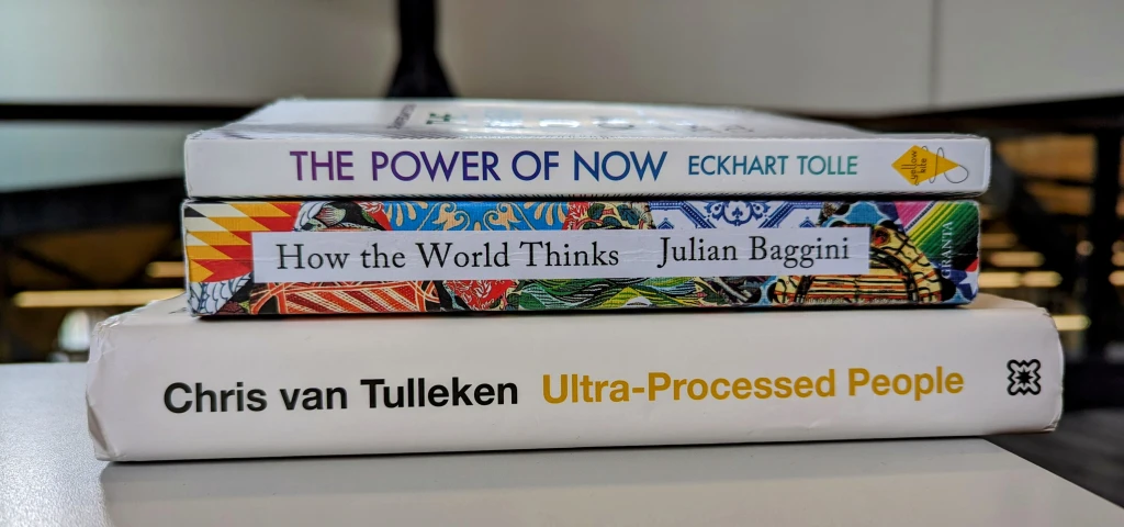 A Literary Journey Through November 2023: Insights from “Ultra Processed People,” “The Power of Now,” and “How the World Thinks”